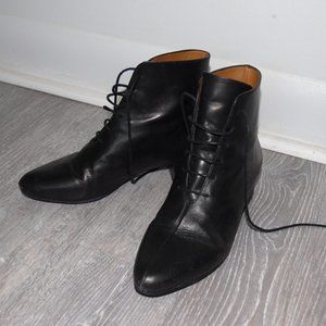 Minimalist black leather ankle boots